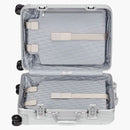 Dior y Rimowa Cabina Malura de gris/azul