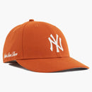 Aime Leon Dore x New Era Chain Stitch Yankees tiene naranja