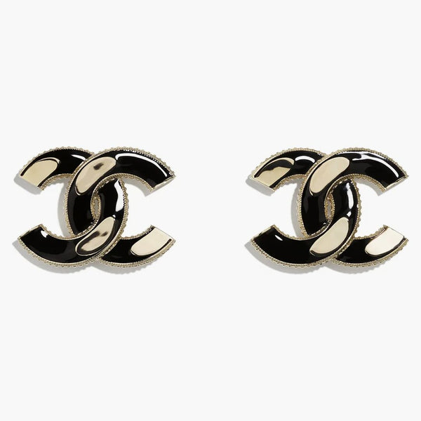 Chanel sammanlåsande örhängen svart/guld
