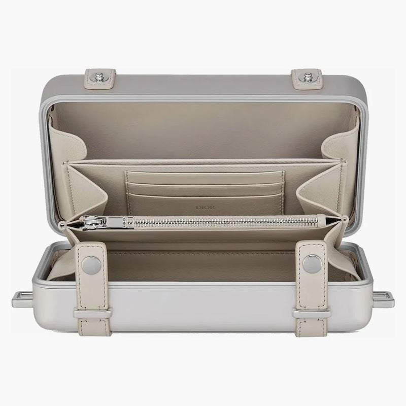Osobní spojka Dior X Rimowa na hliníku na popruh
