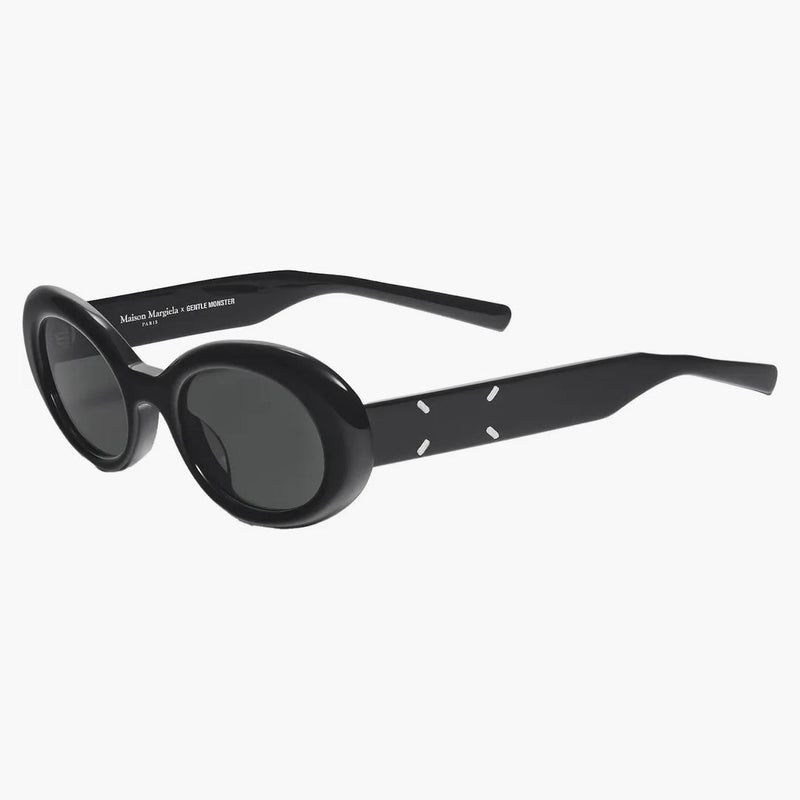 Monster Gentle Monster Maison Margiela occhiali da sole ovali neri mm005 01