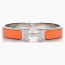 Bracciale Hermes stretto clic clac h smalto pm arancione tono d'argento