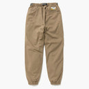 Lidské vyráběné kalhoty béžové