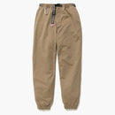 Lidské vyráběné kalhoty béžové