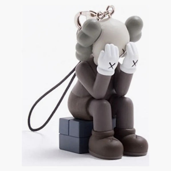 Kaws Passing Through Keychain Brown