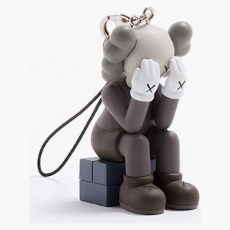 Kaws Passing Through Keychain Brown