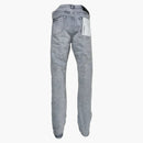 Lila varumärkeslegeringar överdyade grå jeans grå