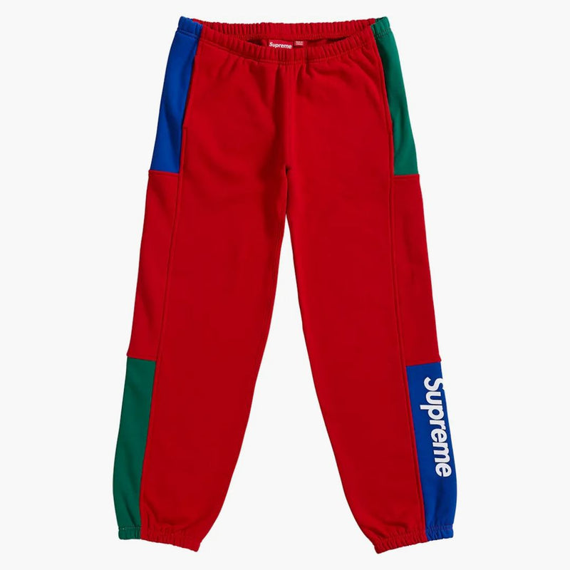 Pantaloni della tuta supremi rossi Acquista su Hypeneedz