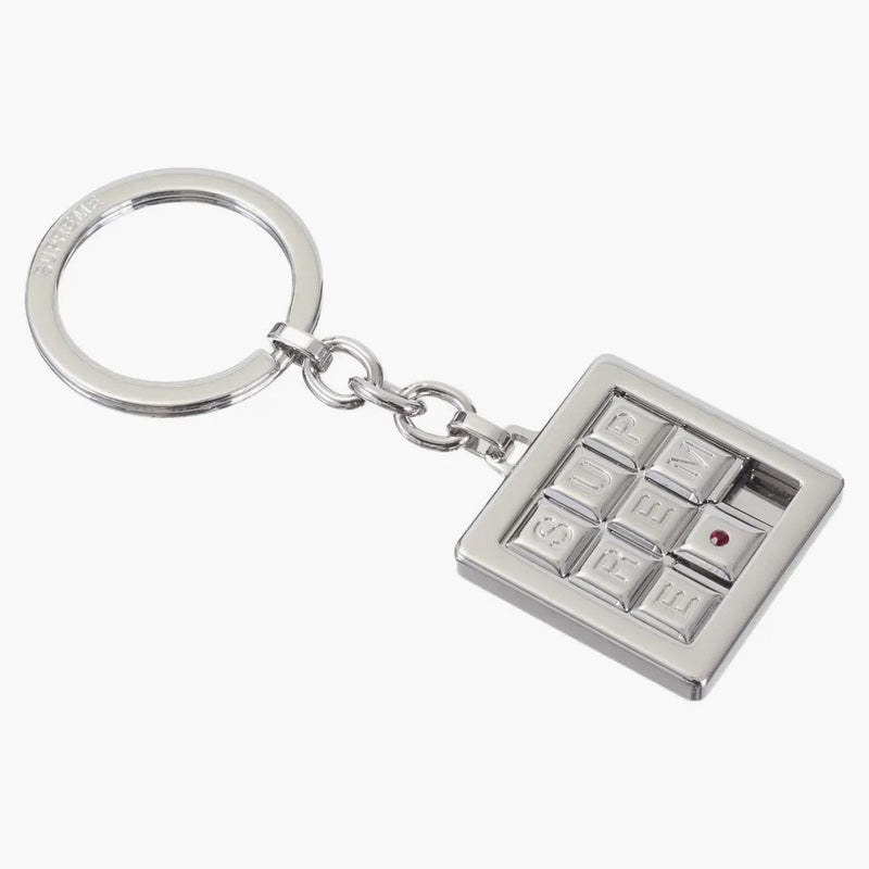 Llavero de rompecabezas supremo de plata