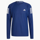 Adidas possiede il tè a maniche lunghe di corsa blu scuro